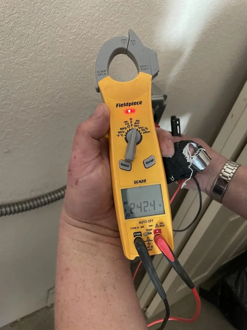 Voltage testing with clamp meter during Aluminum Wiring Replacement in Temple